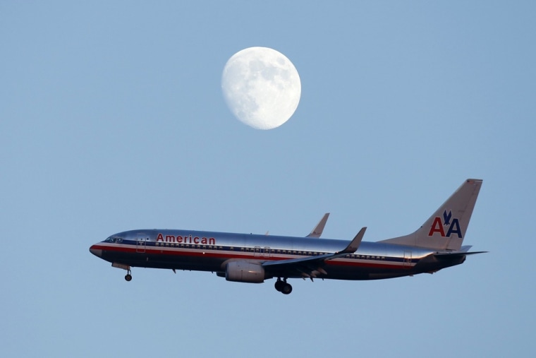 Image: An American Airlines passenger jet comes in the land at LaGuardia airport in New York